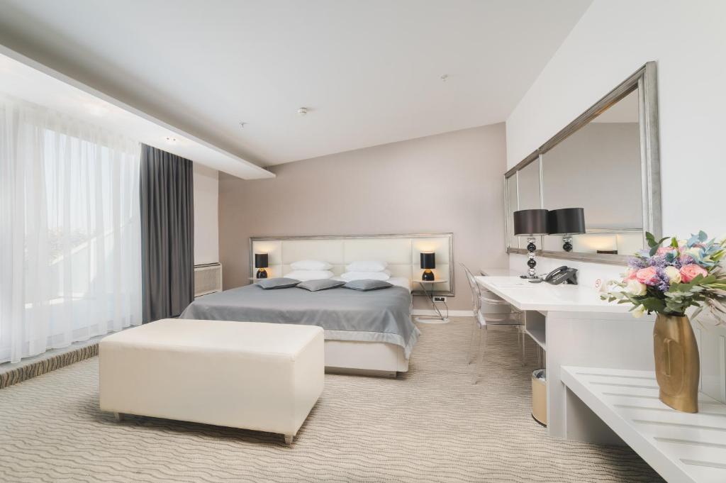 Postel nebo postele na pokoji v ubytování Hotel Aurel