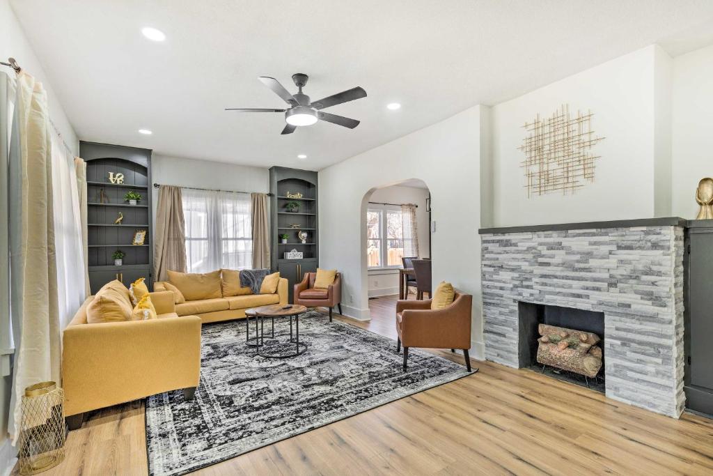 a living room with a couch and a fireplace at Pet-Friendly Wichita Home with Deck, Near Dtwn in Wichita