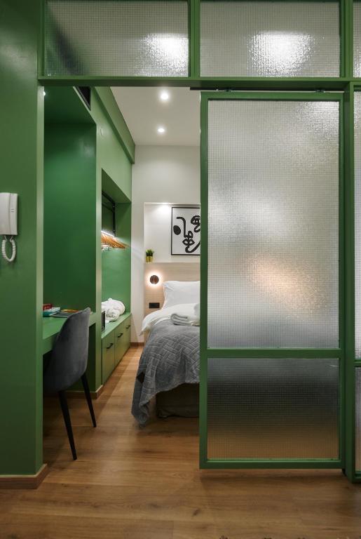 Posteľ alebo postele v izbe v ubytovaní Plane Tree Luxury Suites