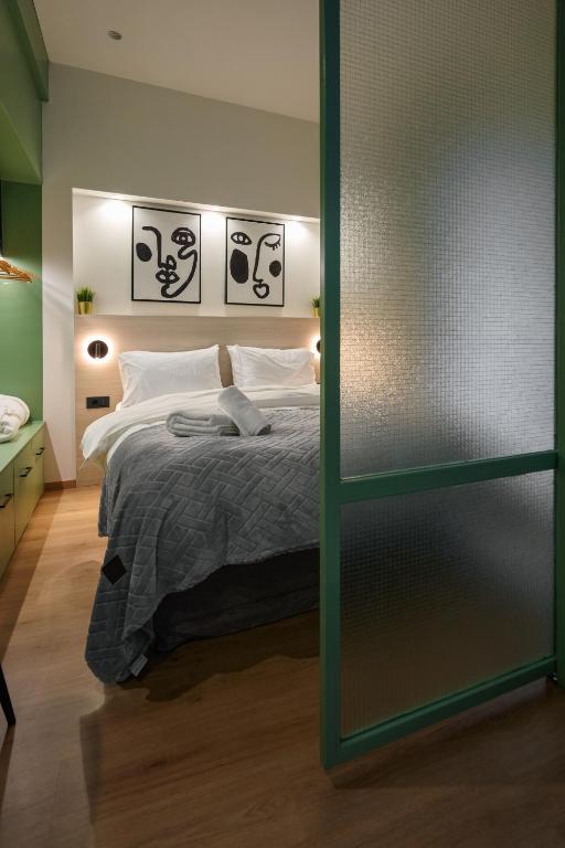 Posteľ alebo postele v izbe v ubytovaní Plane Tree Luxury Suites