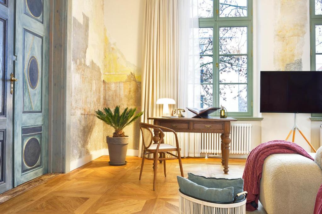 Televízia a/alebo spoločenská miestnosť v ubytovaní ARCHE Dwór Uphagena Gdańsk