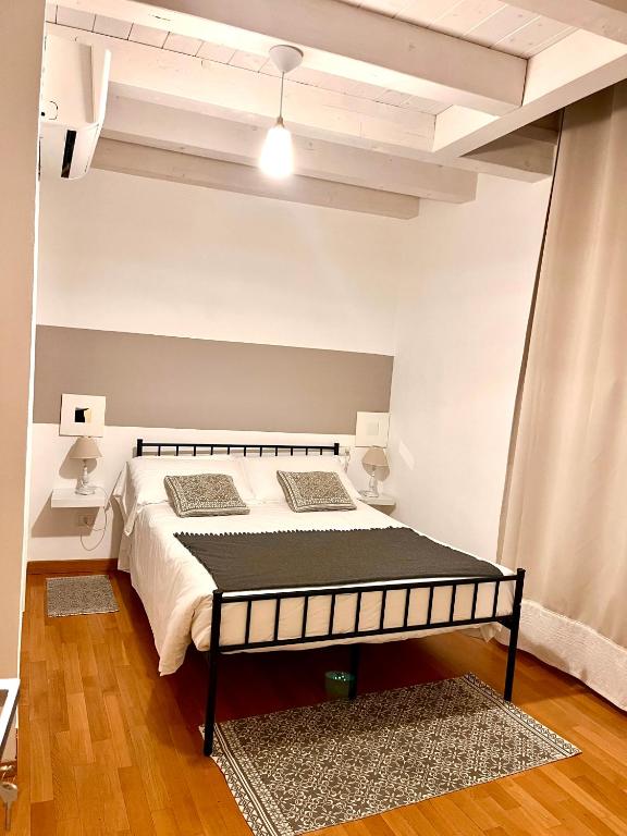 Postel nebo postele na pokoji v ubytování RESIDENZA SERENA B&B -Centro Storico