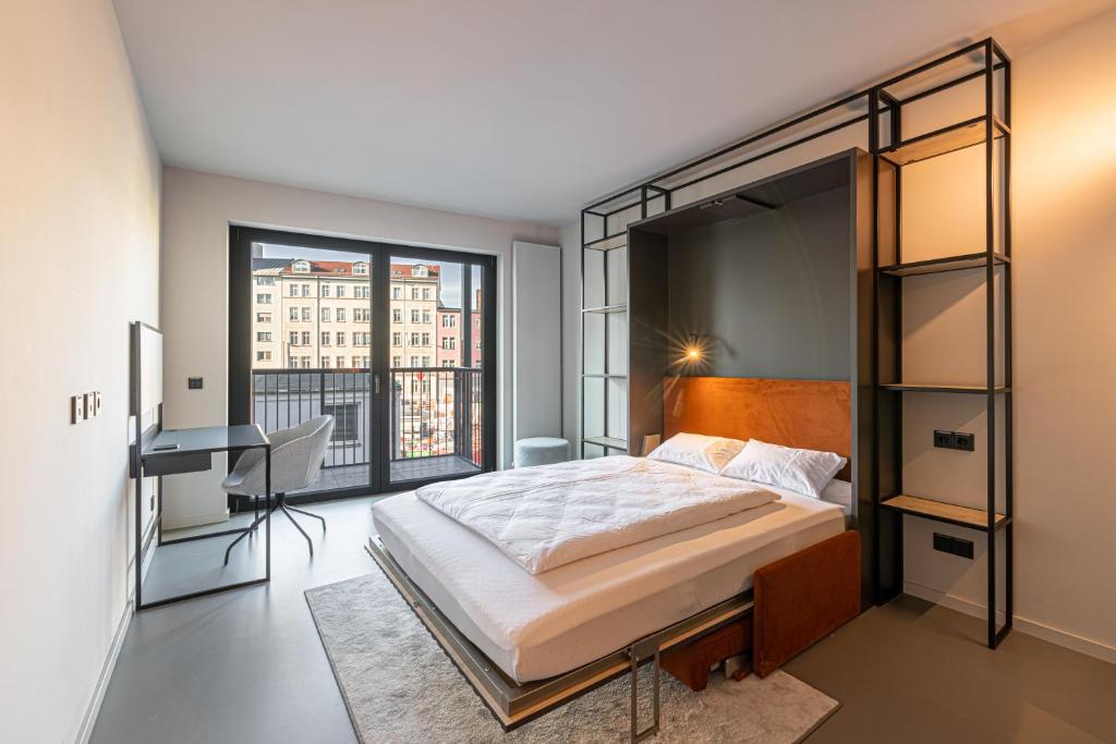 Postel nebo postele na pokoji v ubytování YUMA Apartments Leipzig Berliner Straße