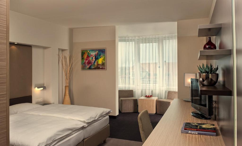 Postel nebo postele na pokoji v ubytování Estrel Berlin