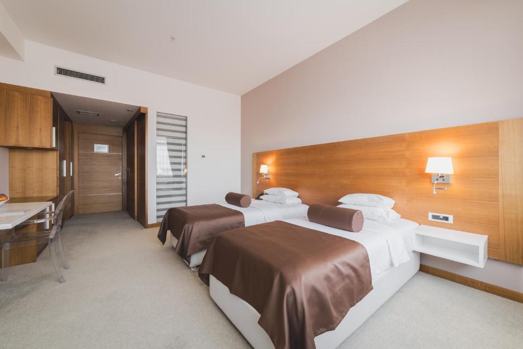 Postel nebo postele na pokoji v ubytování Hotel Aurel