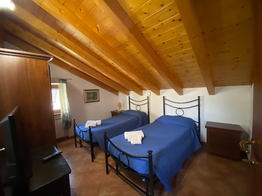 Postel nebo postele na pokoji v ubytování Il Vecchio Noce