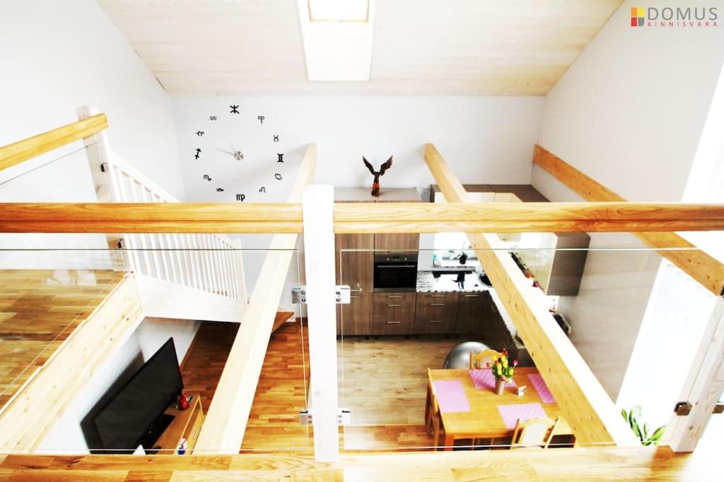 a room with a staircase and a living room at Veski Villa in Pärnu