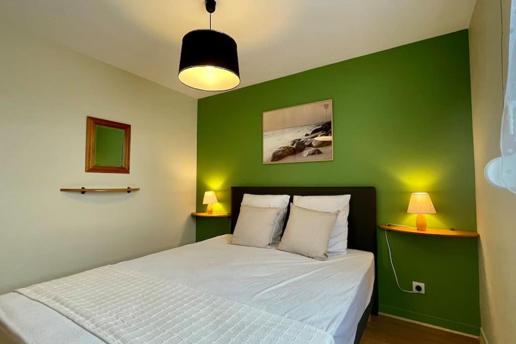 Posteľ alebo postele v izbe v ubytovaní Appartement MerliDunes Proche de la plage