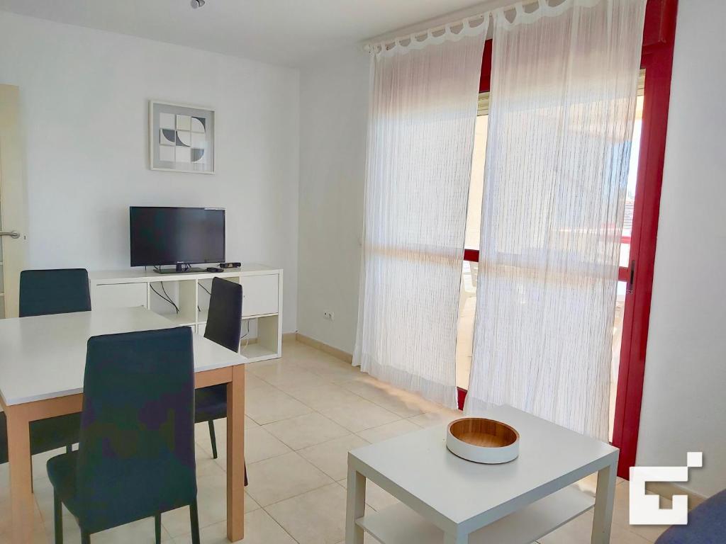 Televízia a/alebo spoločenská miestnosť v ubytovaní Apartamento Amatista 29A - Grupo Turis