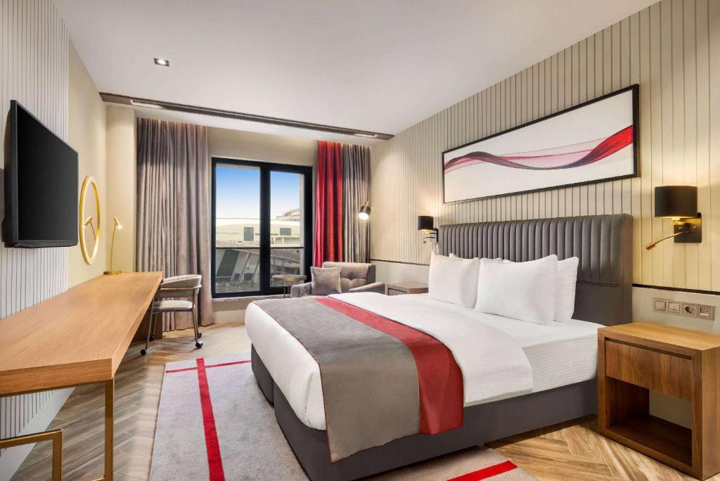 Postel nebo postele na pokoji v ubytování Ramada by Wyndham Erzurum