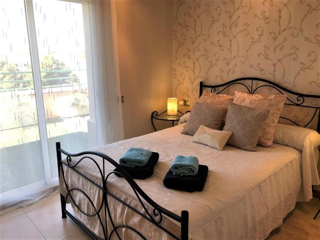 Posteľ alebo postele v izbe v ubytovaní Apartamento Amposta