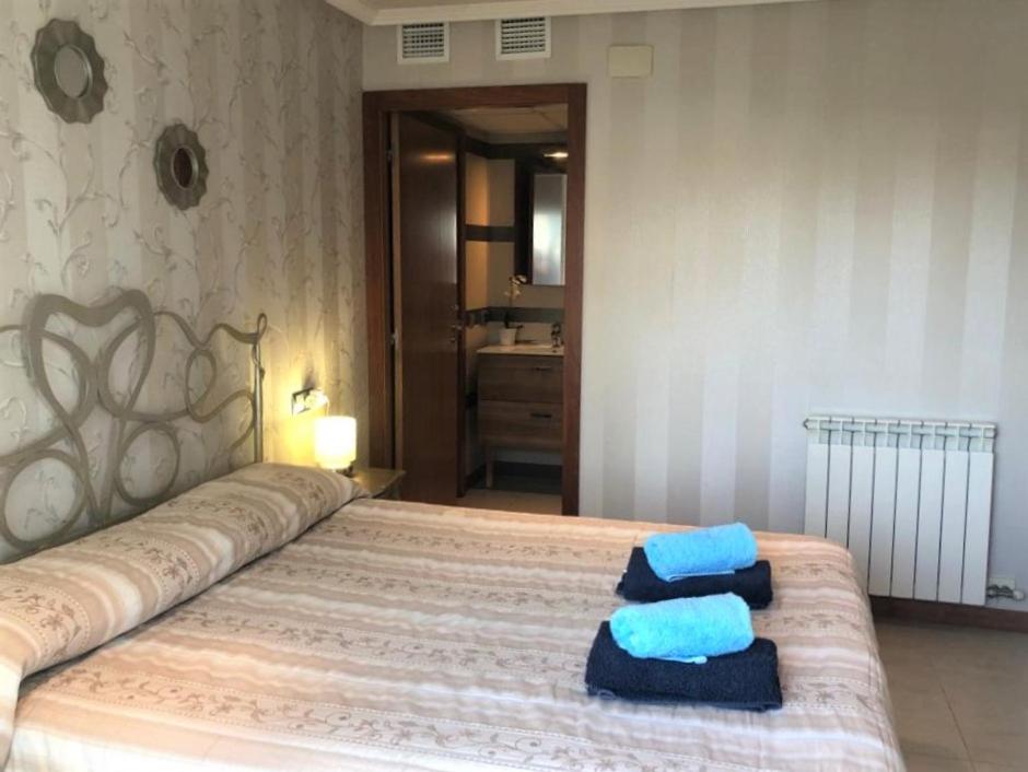 Posteľ alebo postele v izbe v ubytovaní Apartamento Amposta