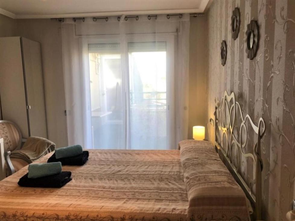 Posteľ alebo postele v izbe v ubytovaní Apartamento Amposta