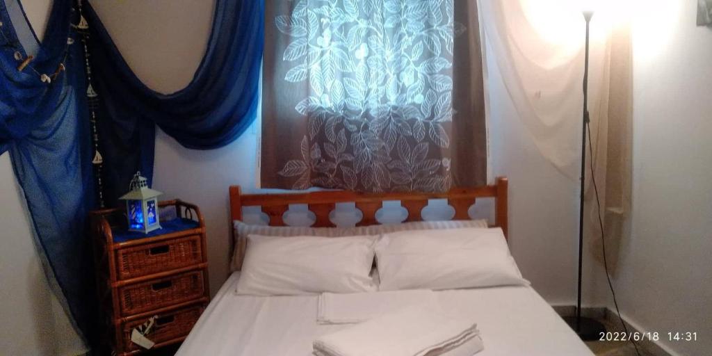 Postel nebo postele na pokoji v ubytování Sevi Platamon Home
