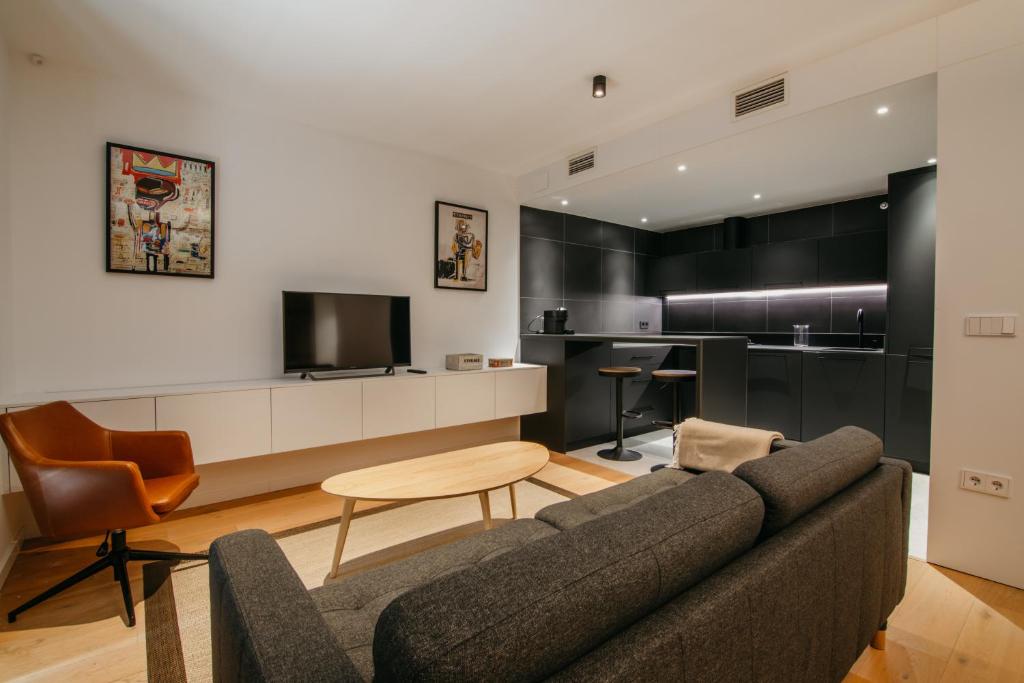TV a/nebo společenská místnost v ubytování tuGuest Obispo Apartment