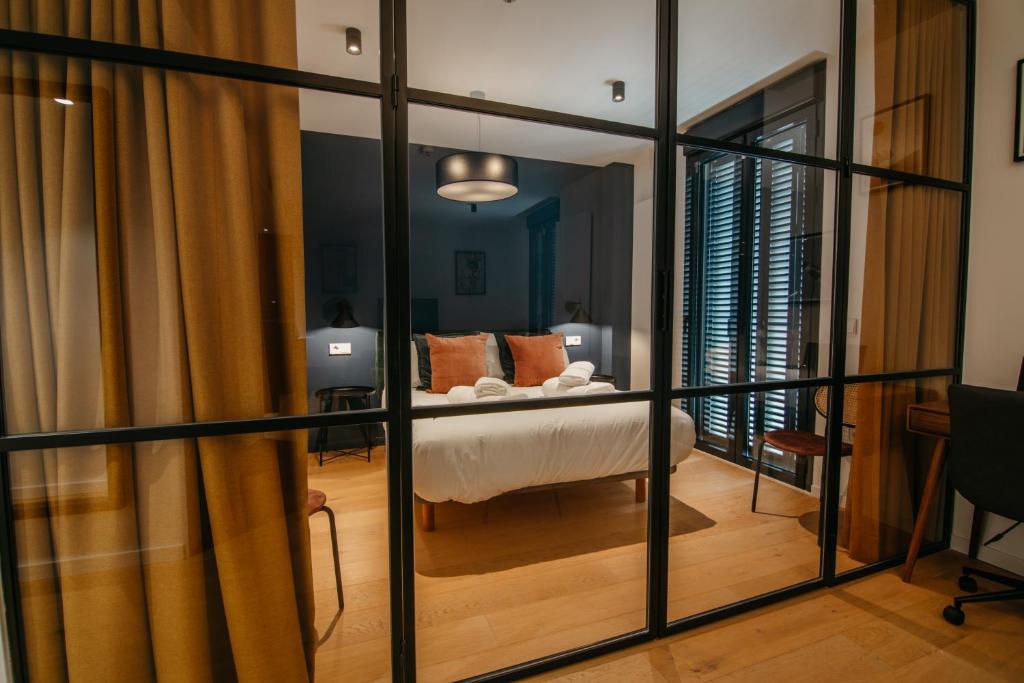 Postel nebo postele na pokoji v ubytování tuGuest Obispo Apartment