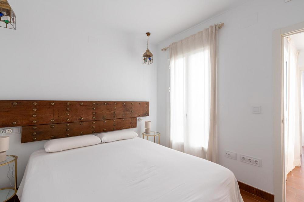 Posteľ alebo postele v izbe v ubytovaní Casa Palacio Sanlúcar de Barrameda