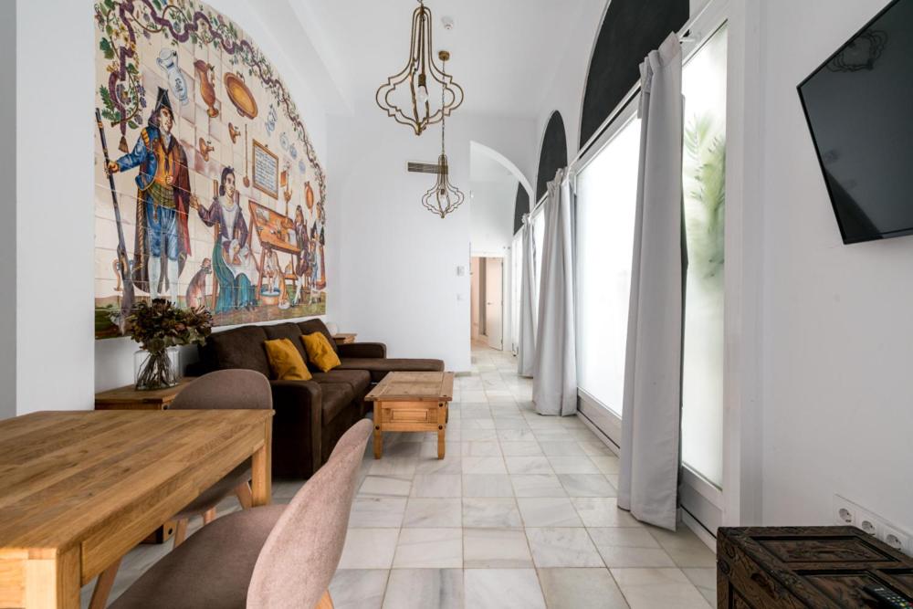 Televízia a/alebo spoločenská miestnosť v ubytovaní Casa Palacio Sanlúcar de Barrameda