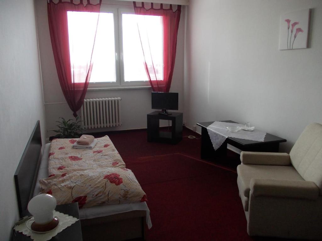 Postel nebo postele na pokoji v ubytování Hotel Milotel