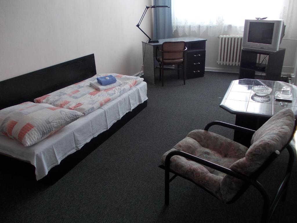 Postel nebo postele na pokoji v ubytování Hotel Milotel