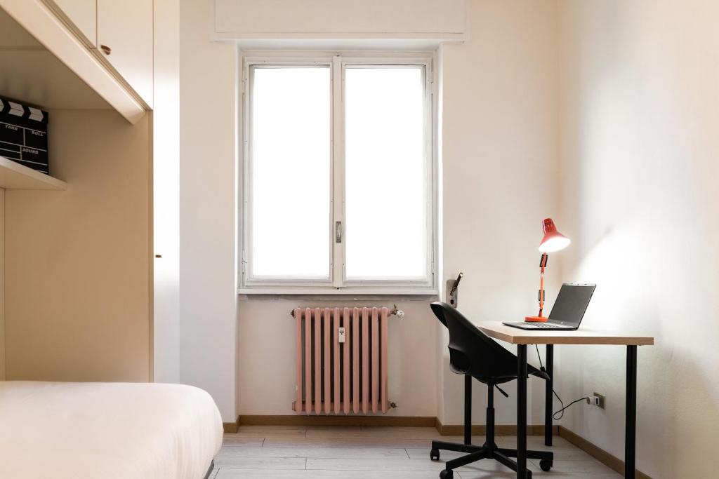 A bed or beds in a room at Accomodo MIT12 Trivano Linate