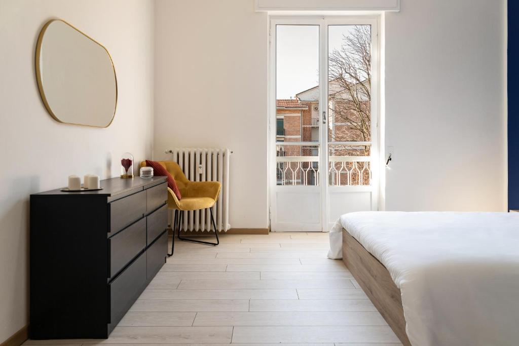 A bed or beds in a room at Accomodo MIT12 Trivano Linate