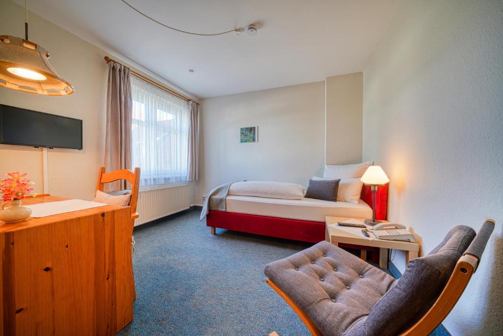 TV a/nebo společenská místnost v ubytování Hotel Zur Eule