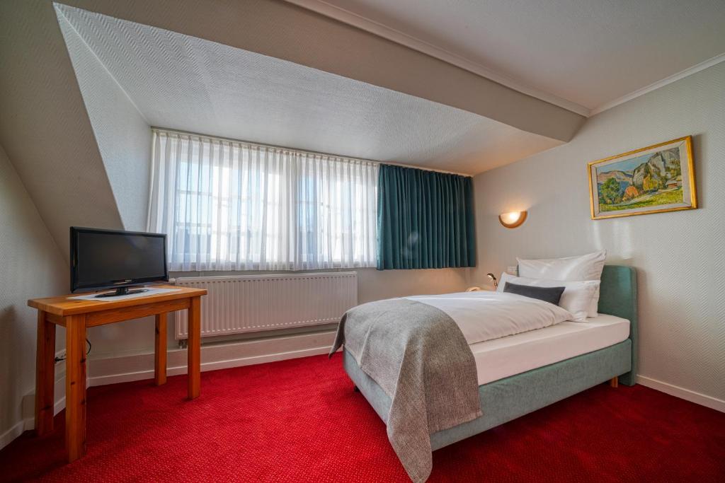 Postel nebo postele na pokoji v ubytování Hotel Zur Eule