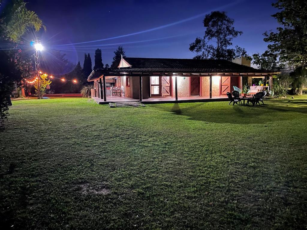 a house with a lawn in front of it at night at RIBERAS DEL RÍO in Oliveros