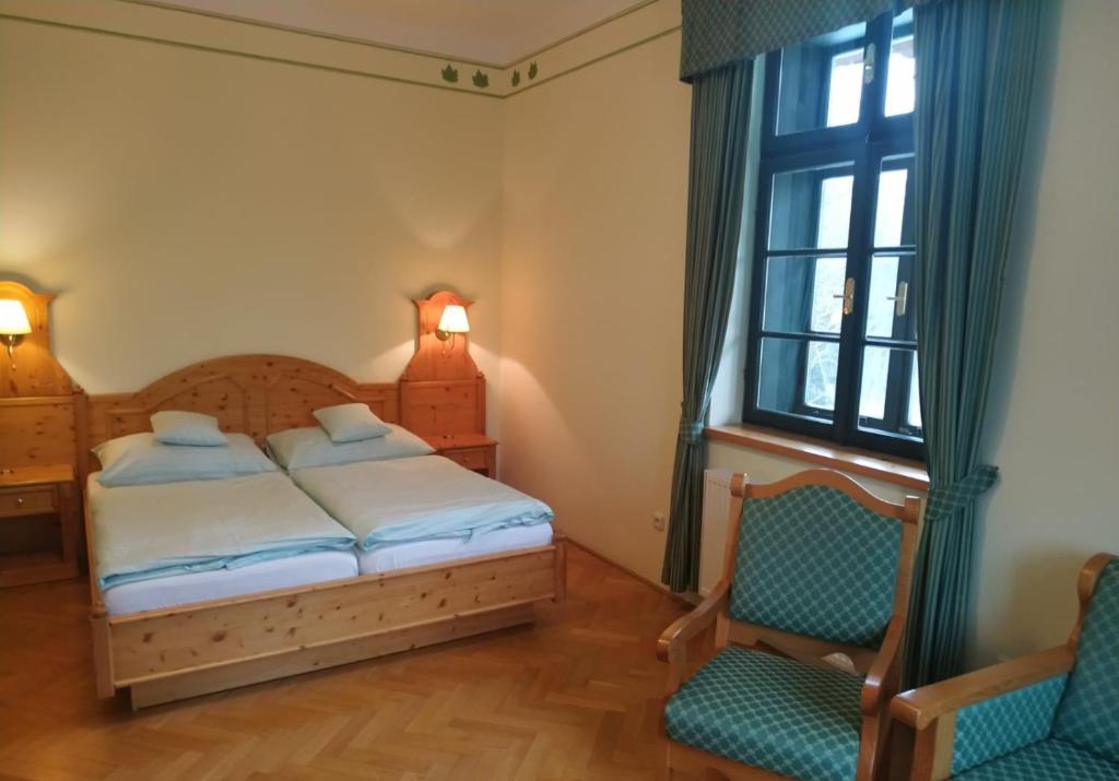 Postel nebo postele na pokoji v ubytování Hotel Svatý Tomáš