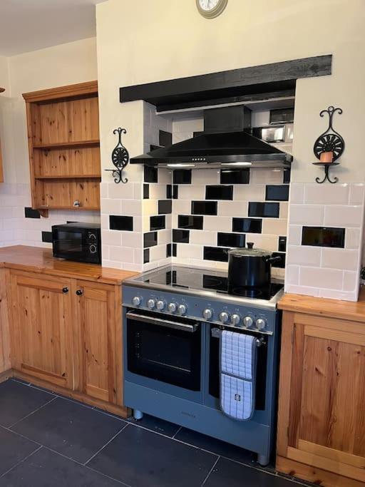 a kitchen with a stove top oven in a kitchen at Ivanhoe Home from Home in Freshwater
