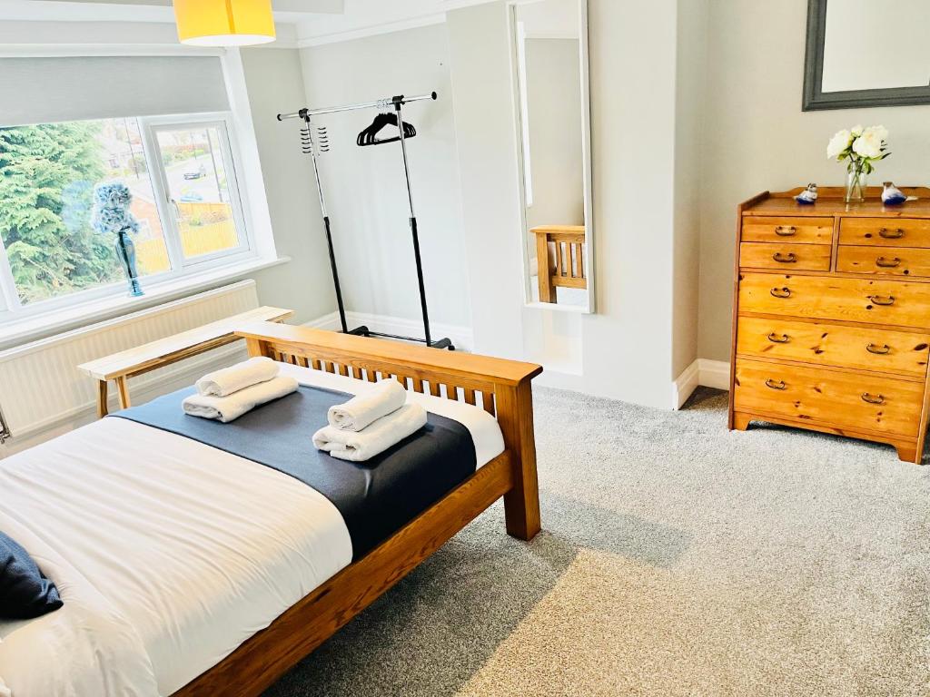 Postel nebo postele na pokoji v ubytování Horsforth Lodge