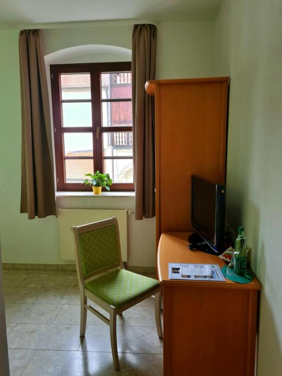 TV a/nebo společenská místnost v ubytování Hotel Brauhaus Wittenberg
