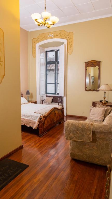 Postel nebo postele na pokoji v ubytování Casa Colonial Quito