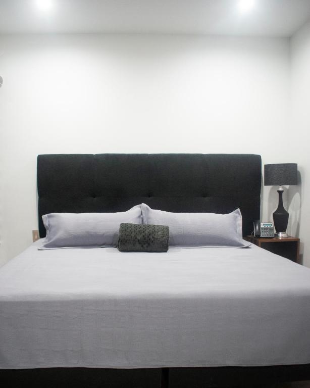 Postel nebo postele na pokoji v ubytování Hotel Manadia