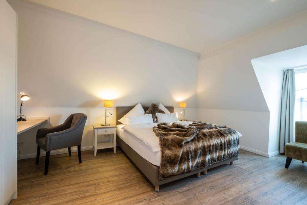 Postel nebo postele na pokoji v ubytování Weisse Villa Apartment 3 1 Hafenkante