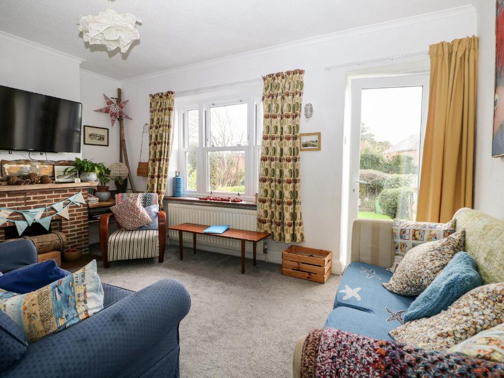 a living room with two couches and a tv at Solent Sea View in Fareham