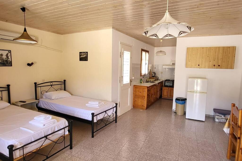 Postel nebo postele na pokoji v ubytování Stamatis studio with seaview - Lakka Paxos