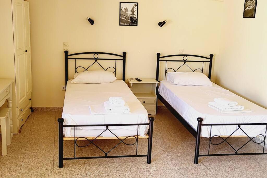 Postel nebo postele na pokoji v ubytování Stamatis studio with seaview - Lakka Paxos