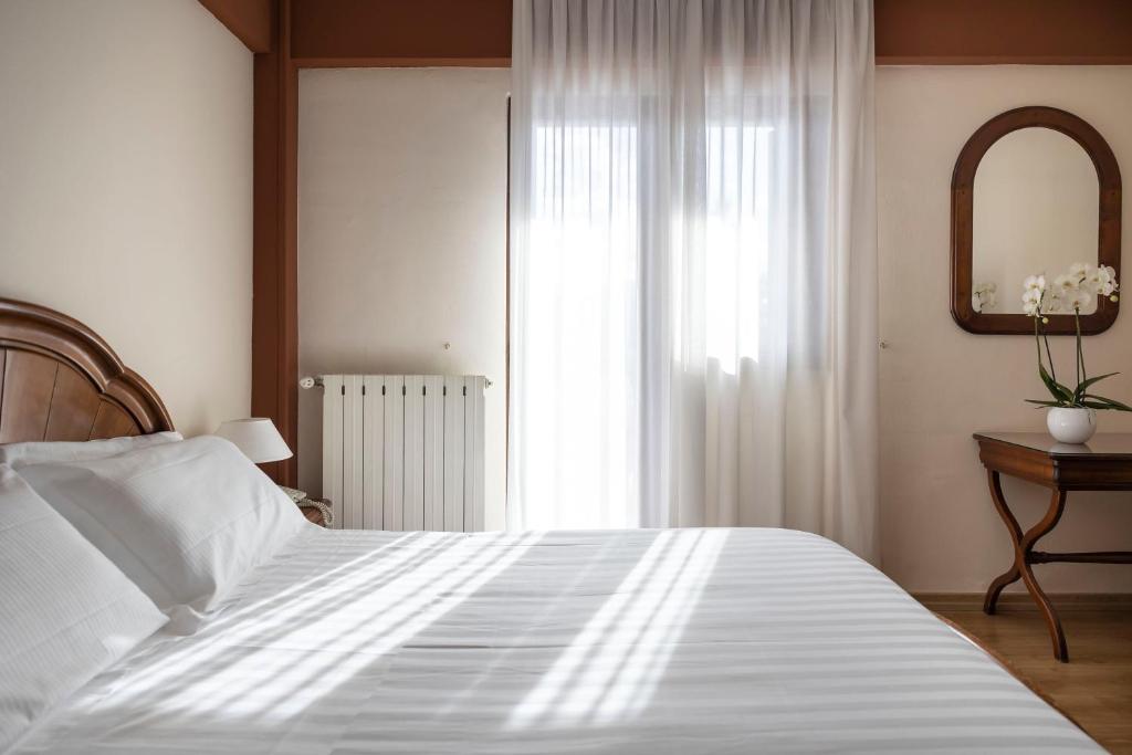 Postel nebo postele na pokoji v ubytování Grand Hotel del Parco