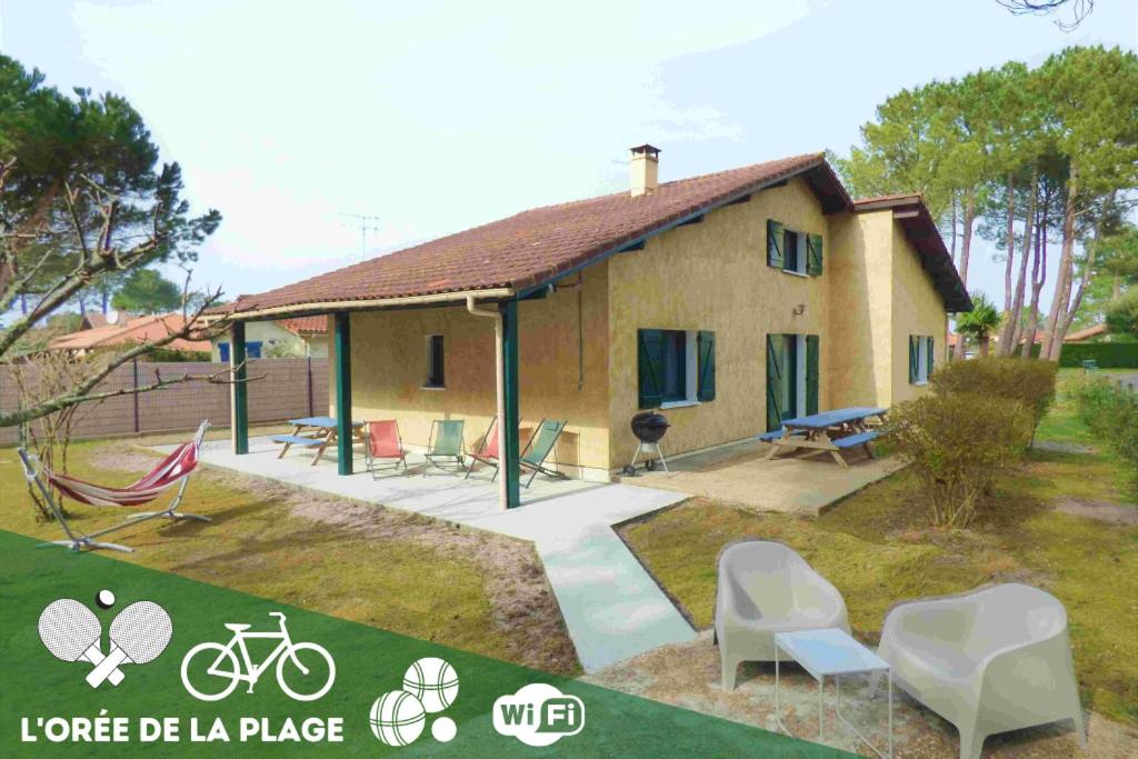 Casa con patio con sillas en L'OREE DE LA PLAGE, 15 pers, Charmante Maison rénovée à Vieux-Boucau, en Vieux-Boucau-les-Bains