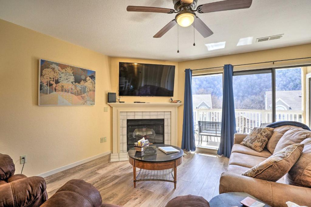 a living room with a couch and a fireplace at Branson Getaway - 10 Mi to Silver Dollar City! in Branson