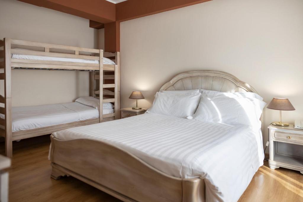 Postel nebo postele na pokoji v ubytování Grand Hotel del Parco