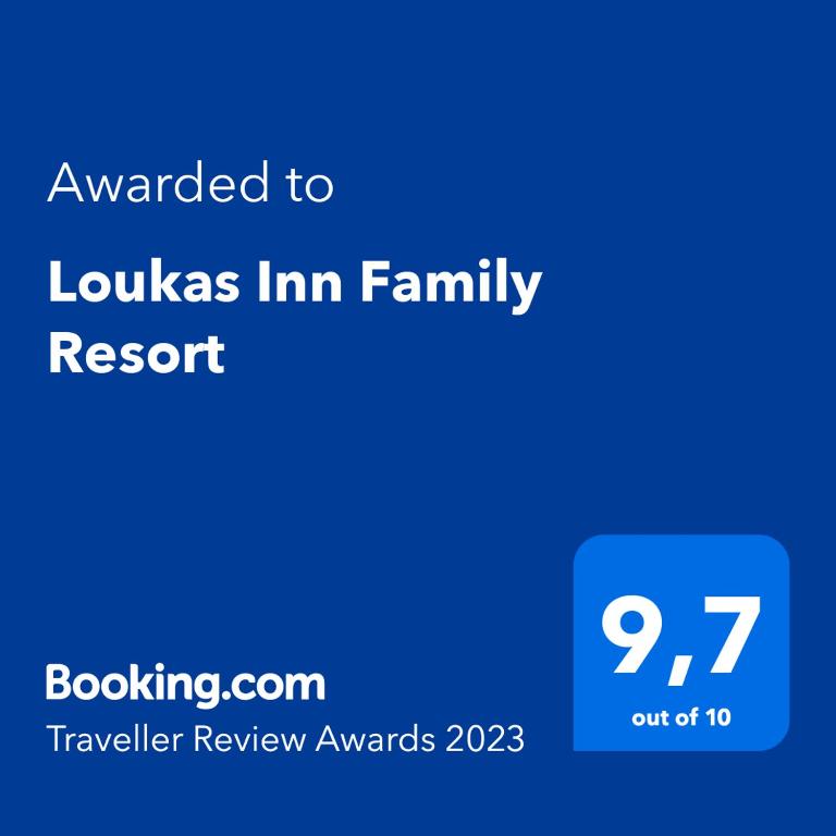 a blue screen with the text awarded to loukas inn family resort at Loukas Inn Family Resort in Keri