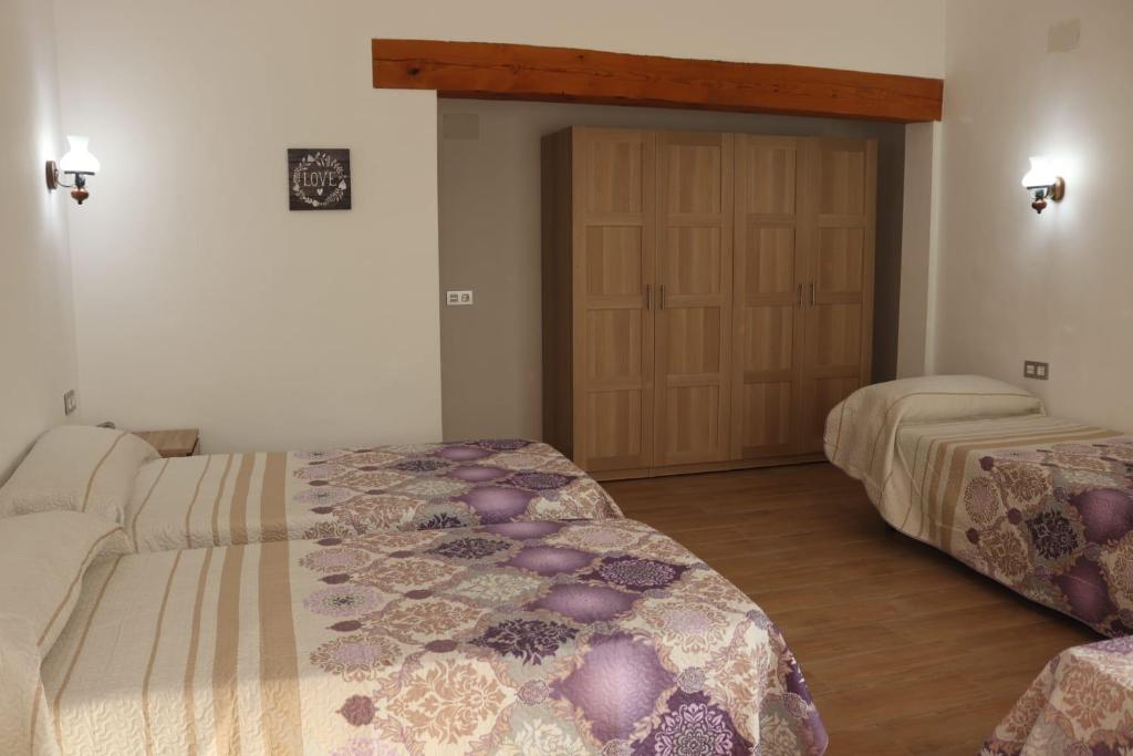 Postel nebo postele na pokoji v ubytování Casa Raíces del Montgo