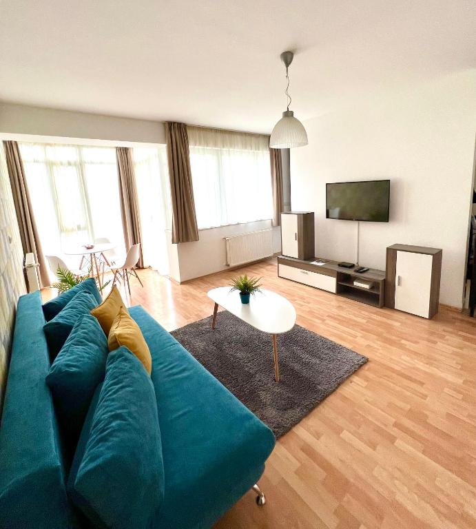 Televízia a/alebo spoločenská miestnosť v ubytovaní Nova Apartments