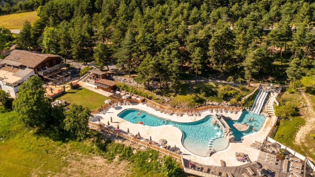 an aerial view of a resort with a swimming pool at Camping RCN Les Collines de Castellane in Castellane