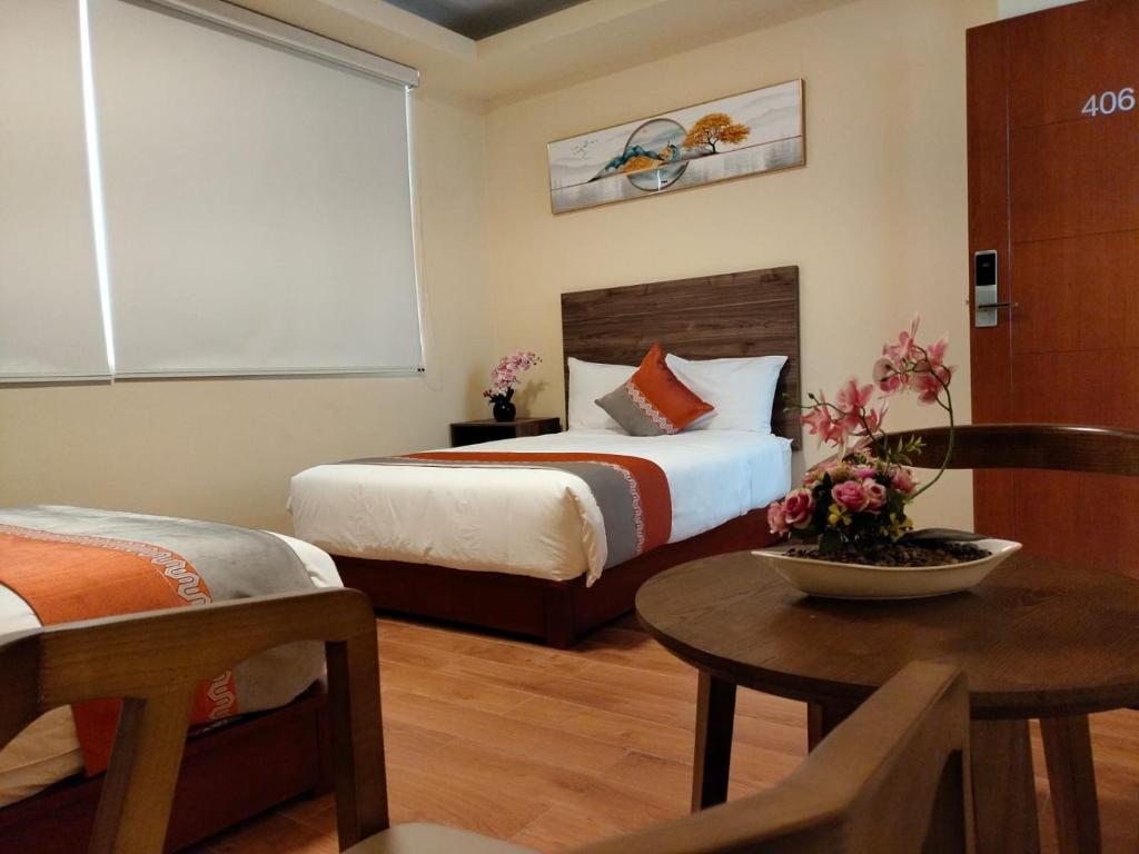 Postel nebo postele na pokoji v ubytování SM HOTEL Plus