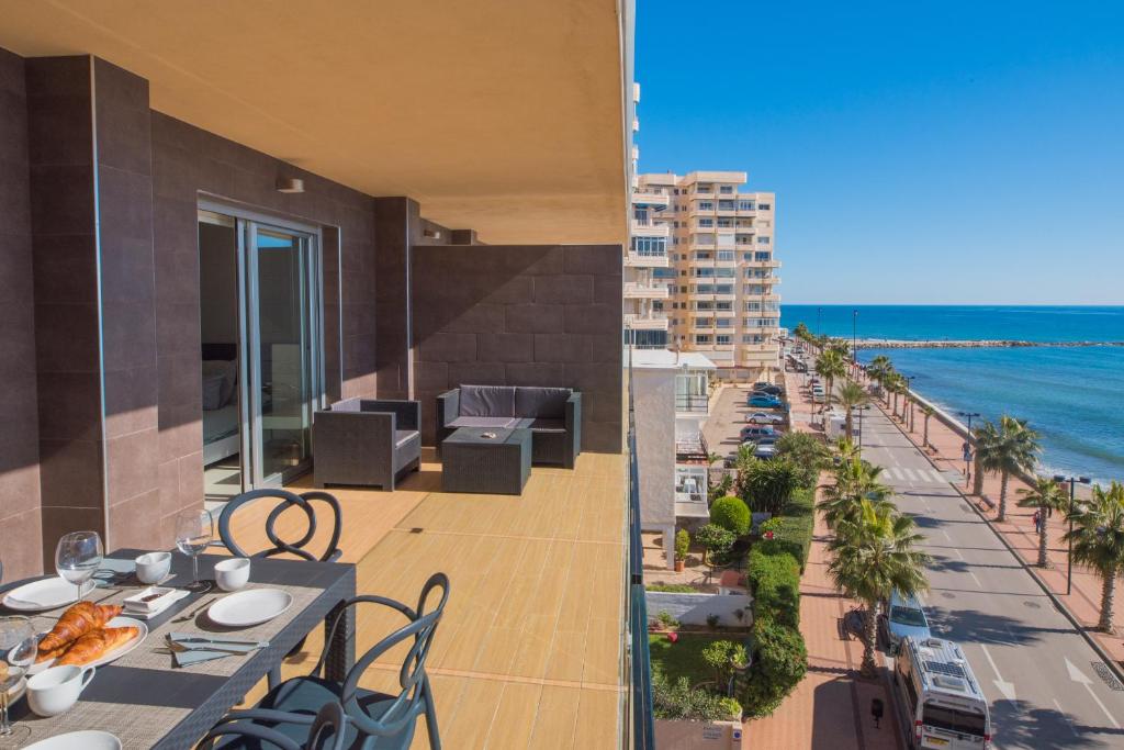a view of the beach from the balcony of a building at Vegasol Playa A.T in Fuengirola