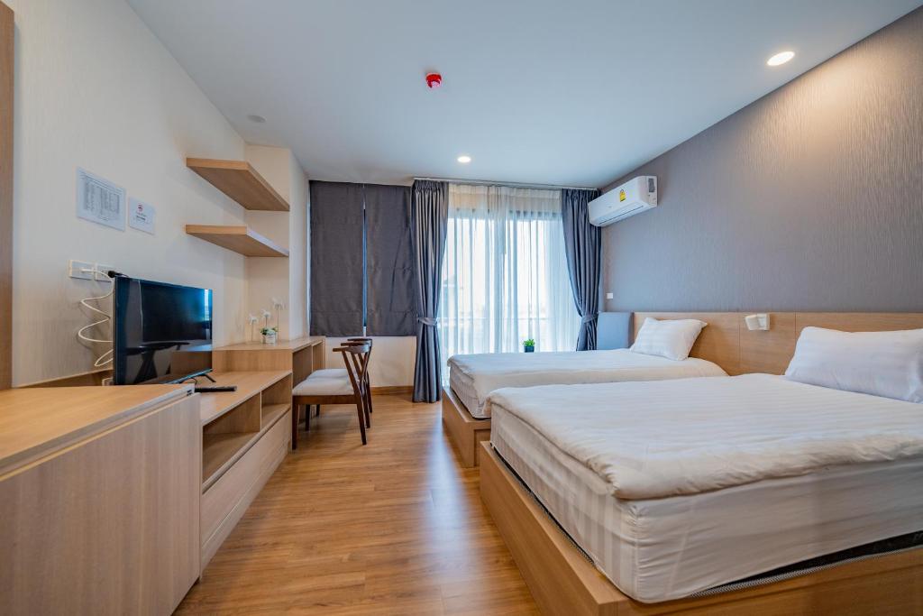 Postel nebo postele na pokoji v ubytování RainTree Condominium